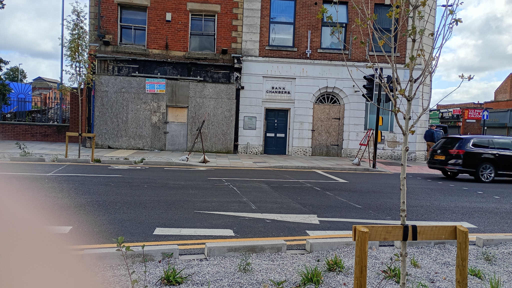 Boarded and neglected buildings facing the newly revamped town square