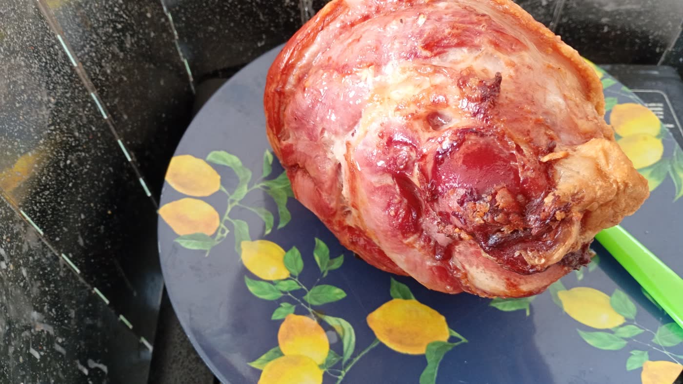 A freshly cooked joint of meat at the campsite