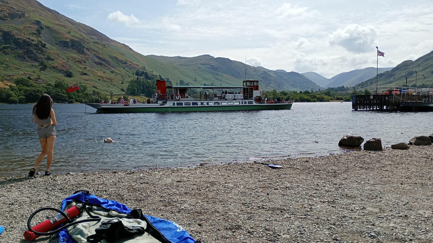 Dave's granddaughter watching a dog swim as an Ullswater steamer passes beneath the hills